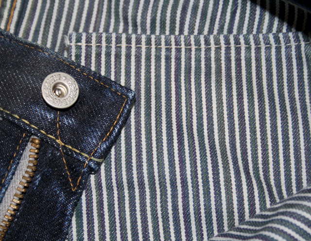 Lined yoke and laurel top button