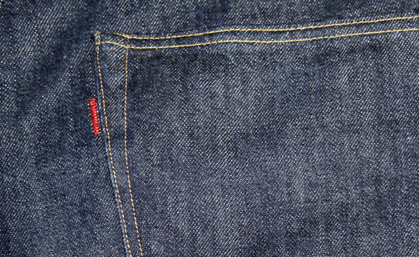 Close-up of 1001 embroidered red tab
