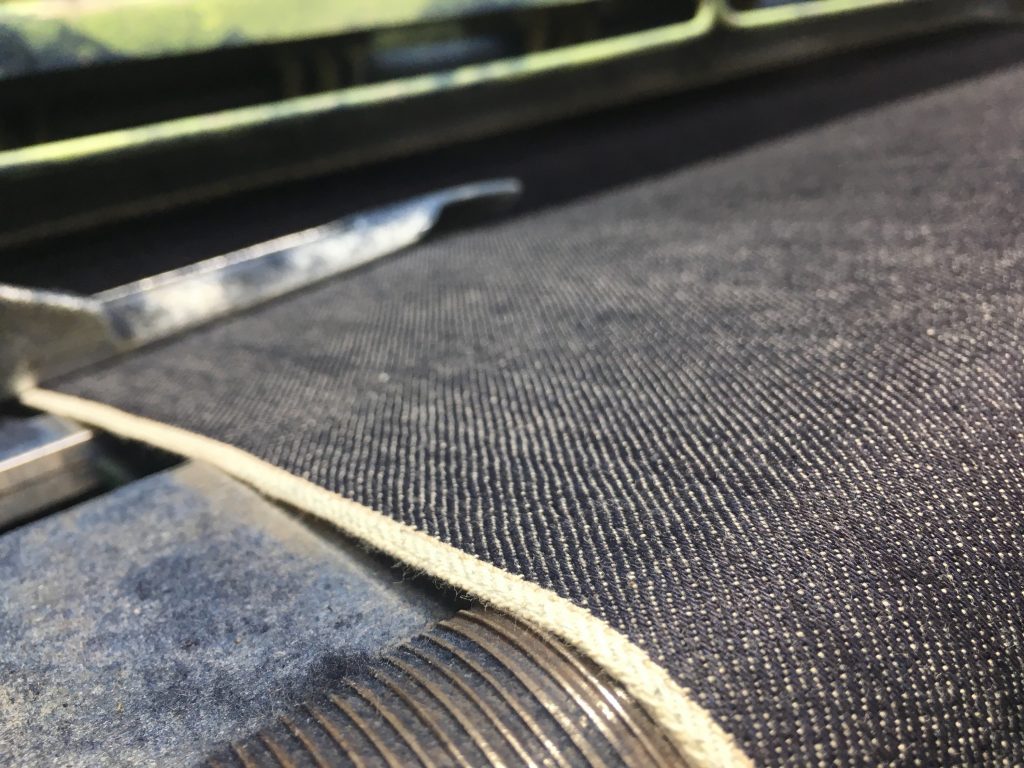 The special 14 oz denim fabric being woven